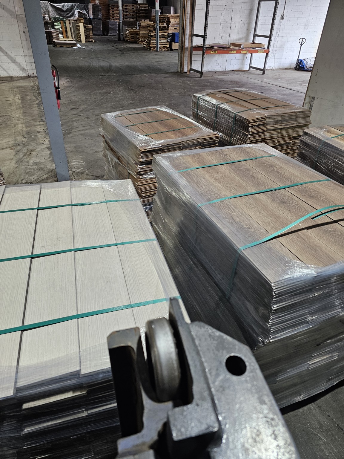 Several hybrid resilient flooring colors in the warehouse